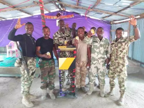Unbelievable!! Soldiers Celebrate Christmas With Their Guns At A Church In Borno (Photos)